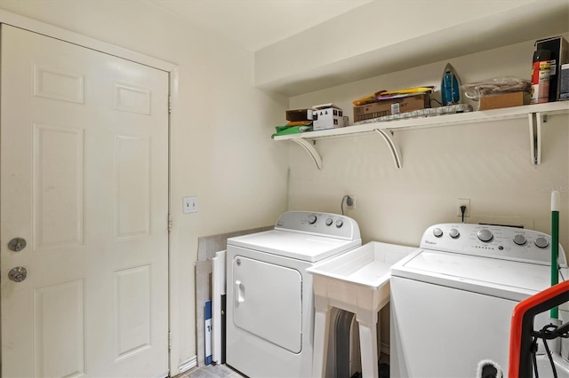 clothes washing area with independent washer and dryer