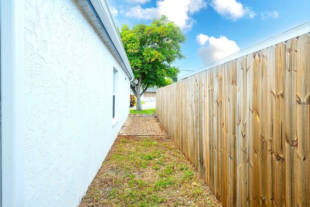 view of home's exterior featuring fence and stucco siding