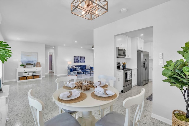 dining space with a chandelier