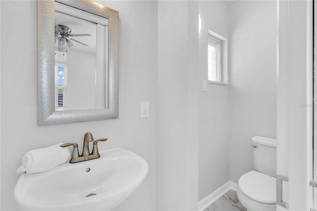 bathroom featuring toilet and sink