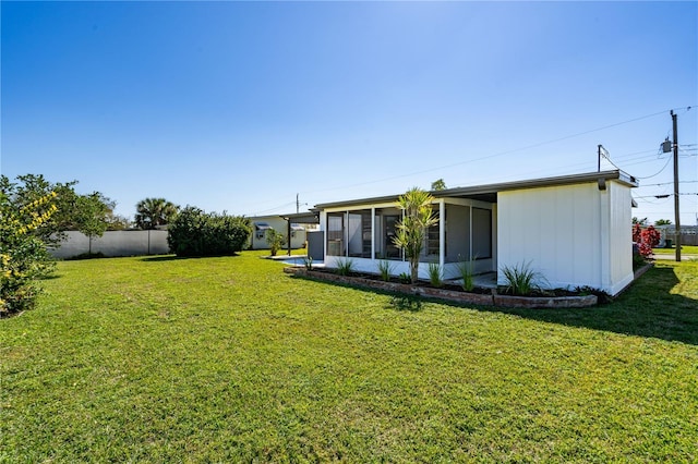 view of yard featuring a sunroom