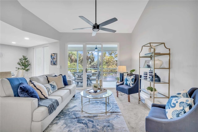 carpeted living room featuring lofted ceiling and ceiling fan