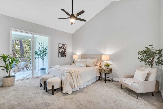 bedroom featuring ceiling fan, light colored carpet, access to exterior, and high vaulted ceiling