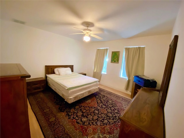 bedroom featuring ceiling fan and hardwood / wood-style floors