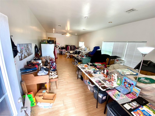 interior space featuring light hardwood / wood-style floors and ceiling fan