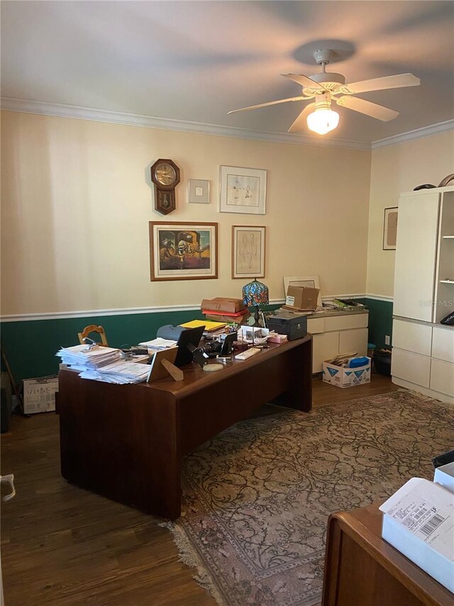 office space featuring crown molding, dark hardwood / wood-style floors, and ceiling fan