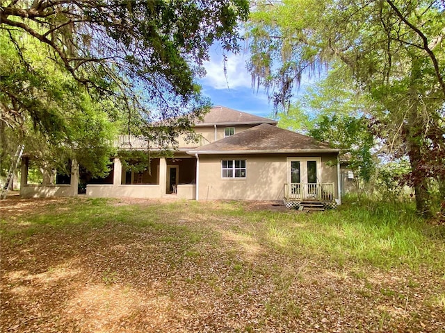 back of house featuring french doors