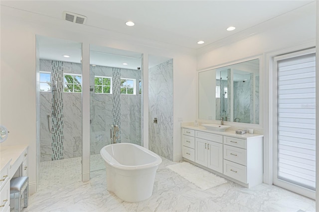 bathroom featuring shower with separate bathtub, tile patterned floors, and vanity