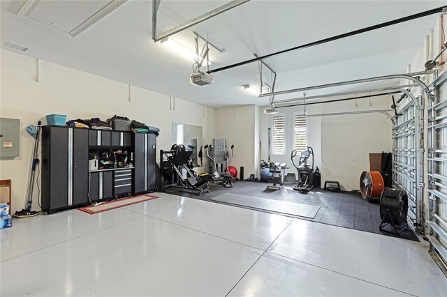 interior space featuring a garage door opener and electric panel