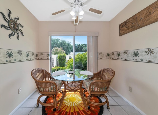 tiled dining area with ceiling fan