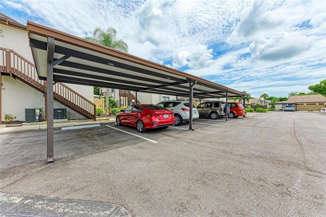 view of parking / parking lot with a carport