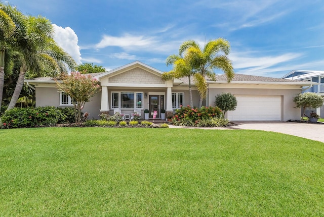 view of front of home with a garage and a front lawn