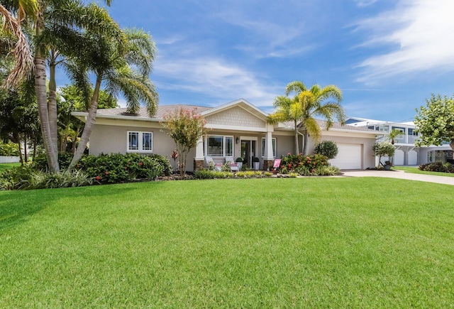 view of front facade with a garage and a front lawn