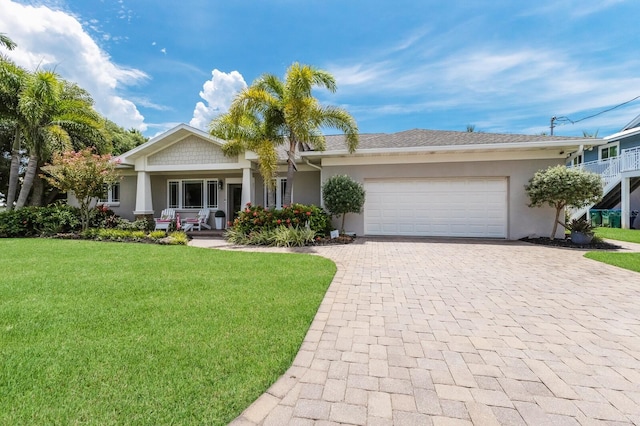 view of front of home featuring a garage and a front yard