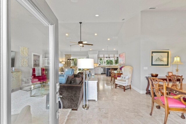 tiled living room featuring high vaulted ceiling and ceiling fan