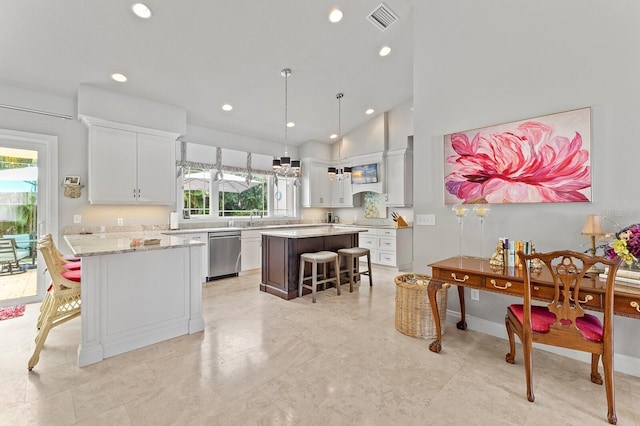 kitchen with white cabinets, dishwasher, a center island, and a wealth of natural light