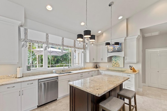 kitchen with white cabinets, vaulted ceiling, sink, light tile patterned floors, and dishwasher