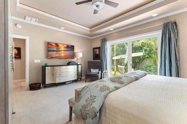 bedroom featuring crown molding, light colored carpet, a raised ceiling, and ceiling fan