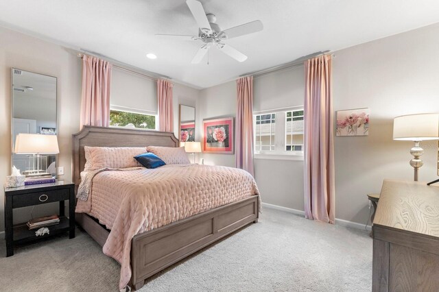 carpeted bedroom featuring ceiling fan