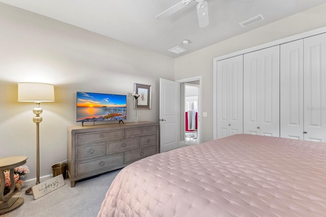 bedroom with a closet, carpet floors, and ceiling fan