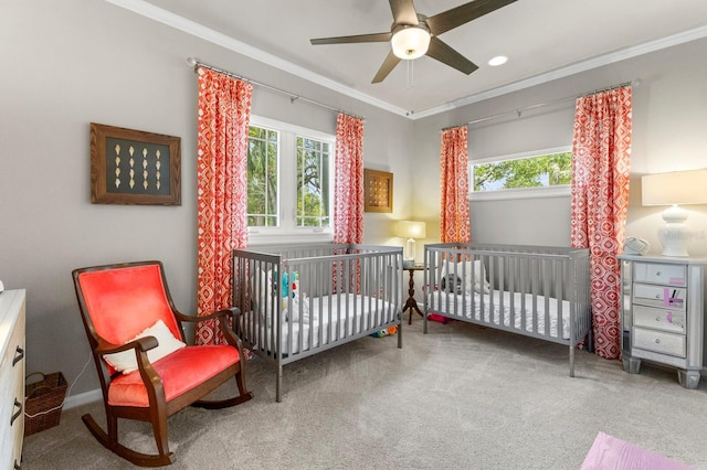 bedroom featuring crown molding, carpet floors, and ceiling fan