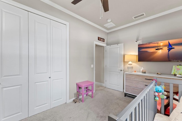 interior space with ceiling fan, ornamental molding, and a closet