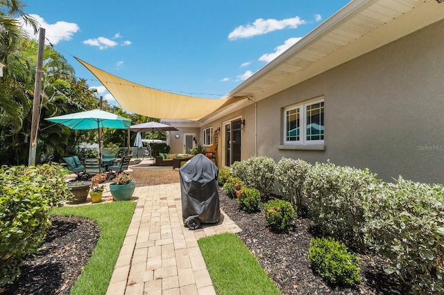 view of patio featuring a grill