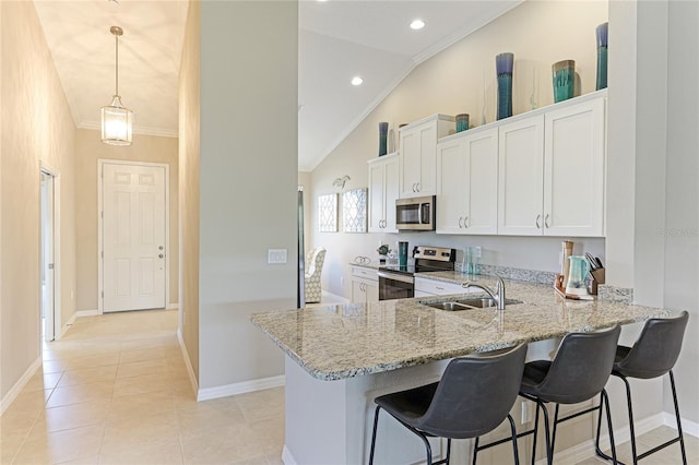 kitchen with crown molding, stainless steel appliances, light tile patterned flooring, white cabinetry, and kitchen peninsula