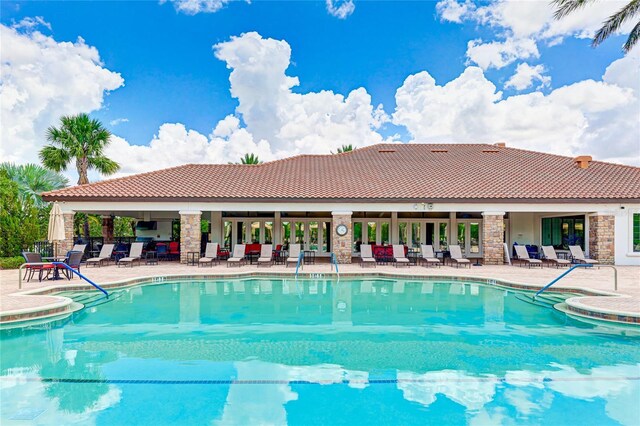 view of pool featuring a patio area