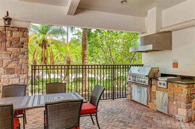 view of patio with area for grilling and exterior kitchen