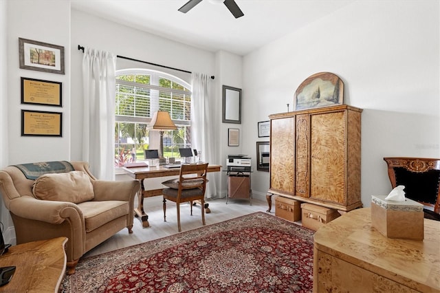 office area with ceiling fan and light hardwood / wood-style floors