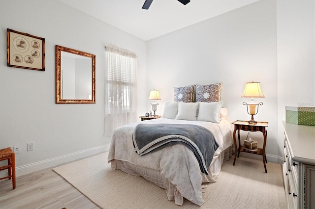 bedroom with light wood-type flooring and ceiling fan