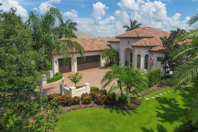 exterior space featuring a garage and a front lawn