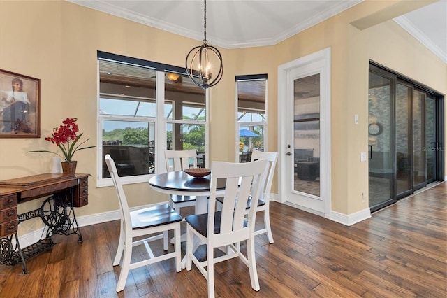 dining room featuring crown molding, dark hardwood / wood-style flooring, and an inviting chandelier