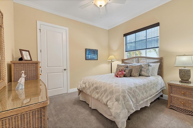 carpeted bedroom featuring ceiling fan and crown molding