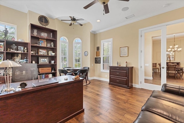 office space with wood-type flooring, ceiling fan with notable chandelier, and a healthy amount of sunlight