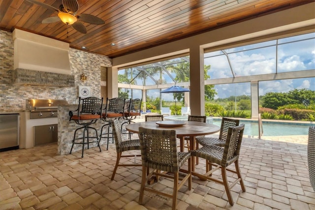 exterior space featuring ceiling fan and wooden ceiling