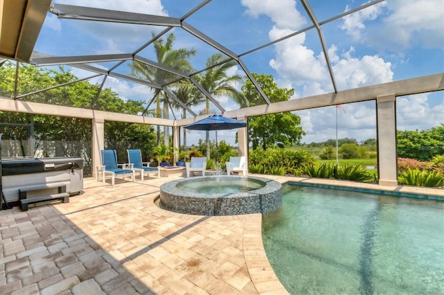 view of swimming pool with glass enclosure, a patio, and an in ground hot tub