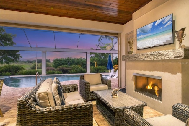 sunroom / solarium featuring a fireplace and wood ceiling