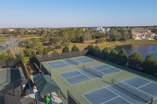 view of sport court with a water view