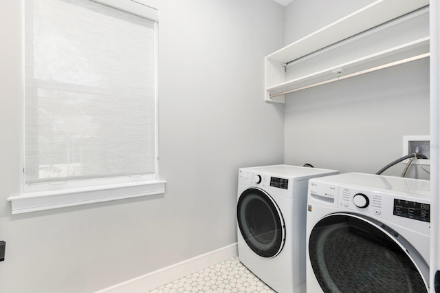 laundry room featuring tile patterned floors and washer and dryer