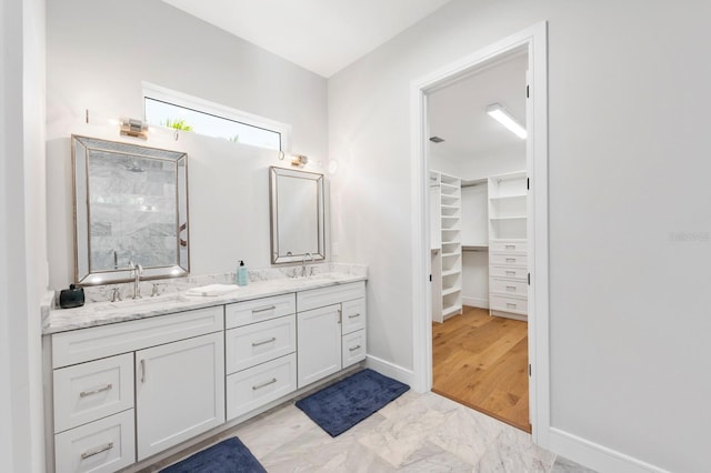 bathroom with dual vanity and tile patterned flooring