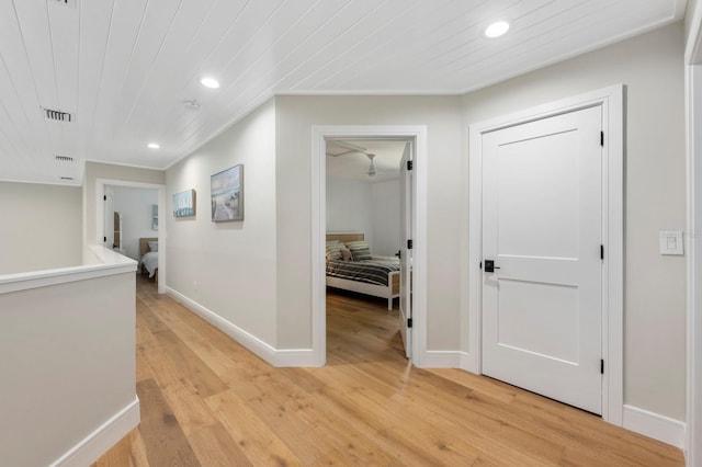 hall with light hardwood / wood-style flooring