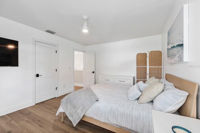 bedroom with light hardwood / wood-style flooring