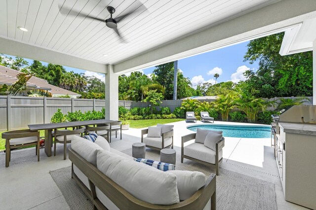 exterior space featuring ceiling fan, outdoor lounge area, and a fenced in pool