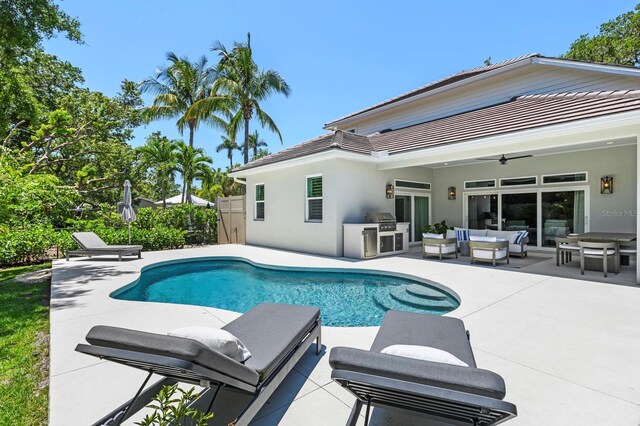 view of pool with an outdoor hangout area, a patio area, and ceiling fan