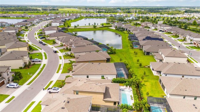 birds eye view of property with a water view