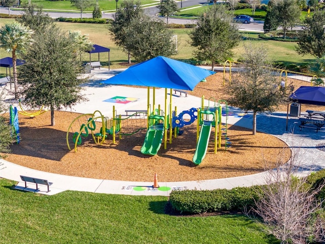 view of jungle gym featuring a lawn