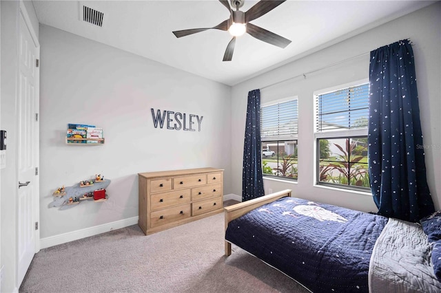 carpeted bedroom with ceiling fan