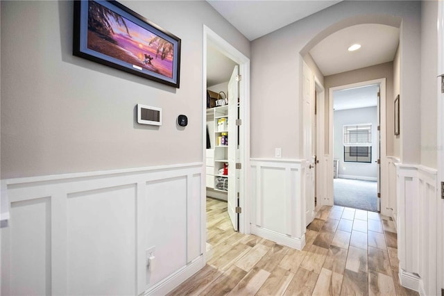 hall with light hardwood / wood-style floors